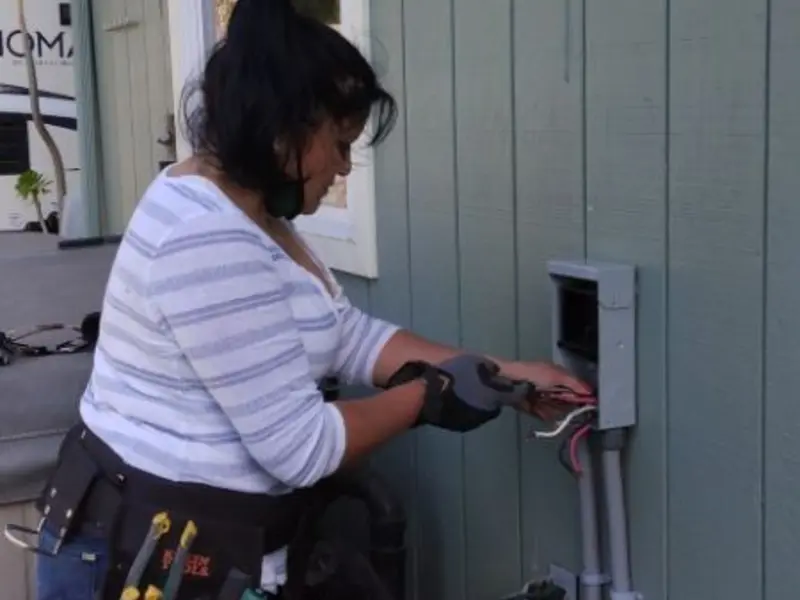 Licensed electrician wiring an exterior subpanel in Seneca Falls